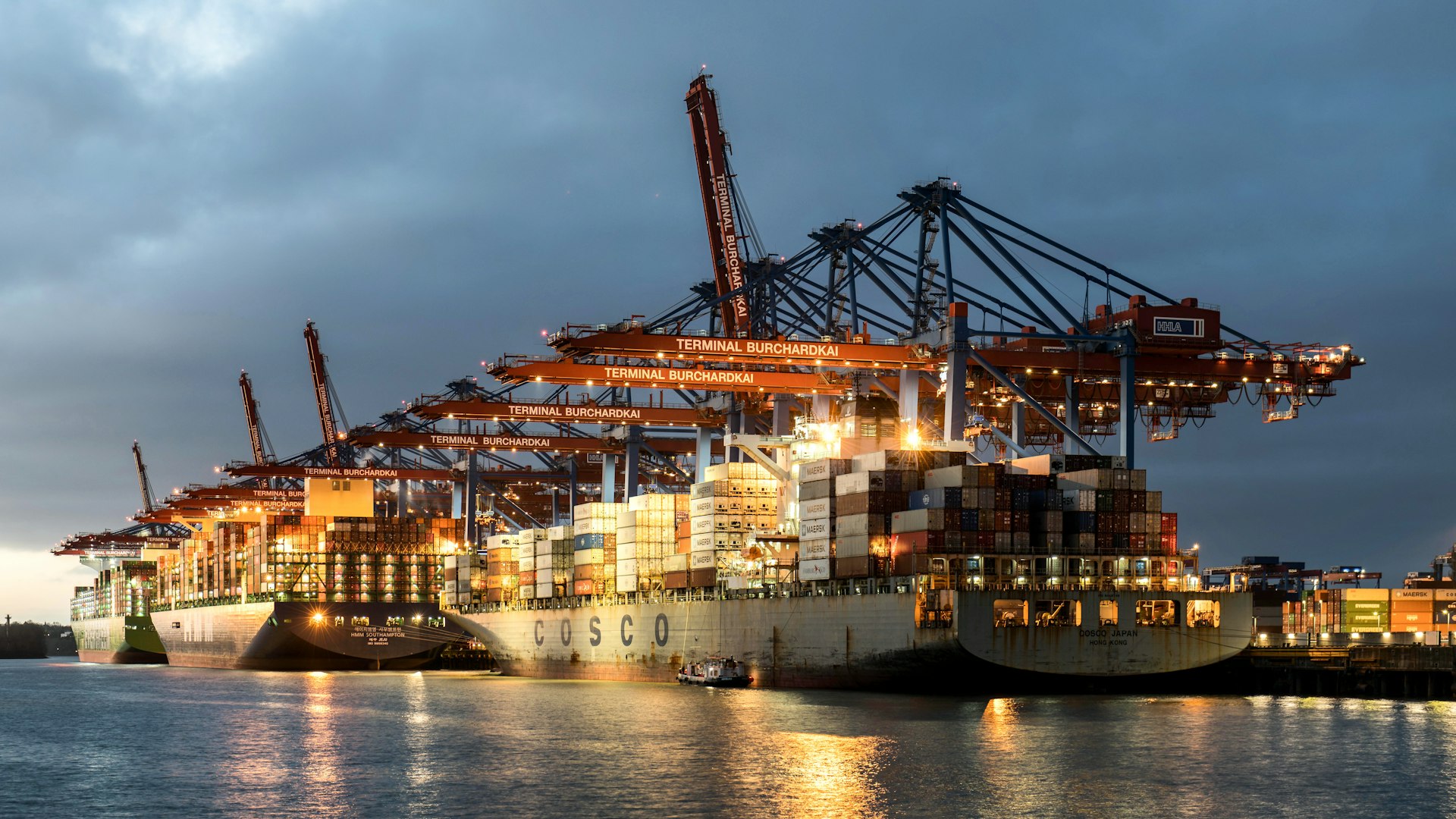 A large ship is docked in the water